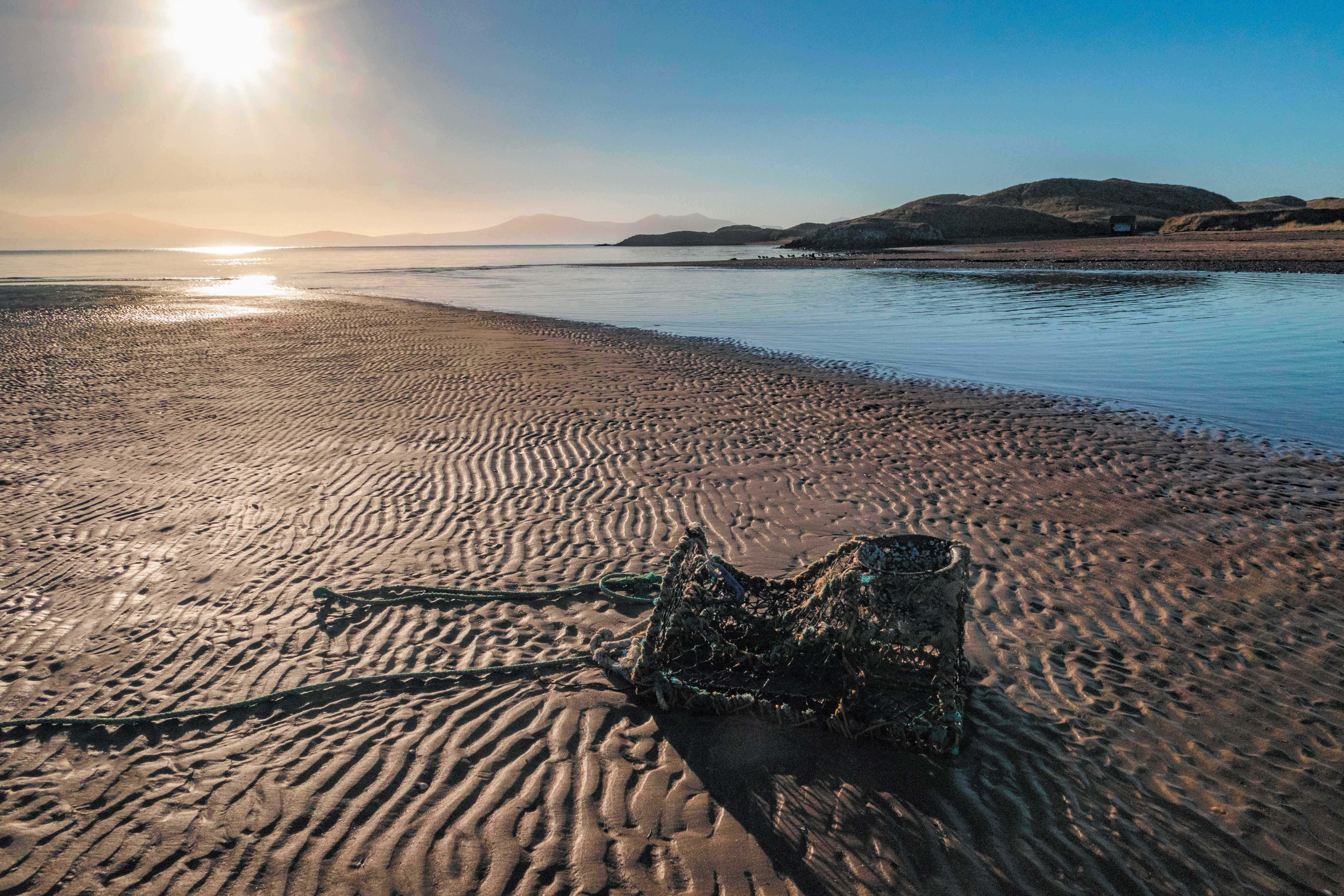 Aerial image of a beach with a broken machine