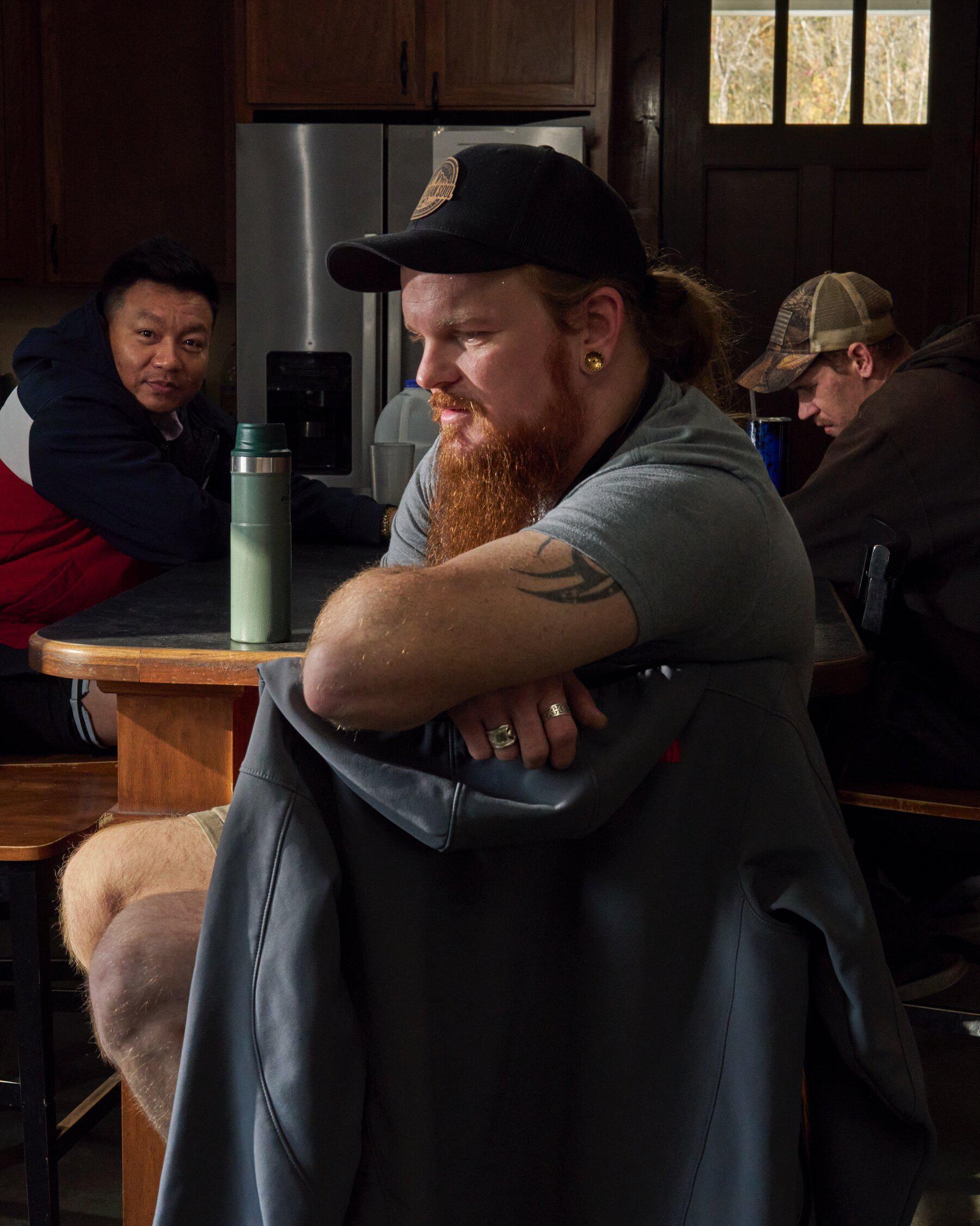 Welding trainees in the kitchen of their shared home, Stone Lodge, in Louisa, Ky. Addiction Recovery Care, which is based in town, operates the home and the business where they work.