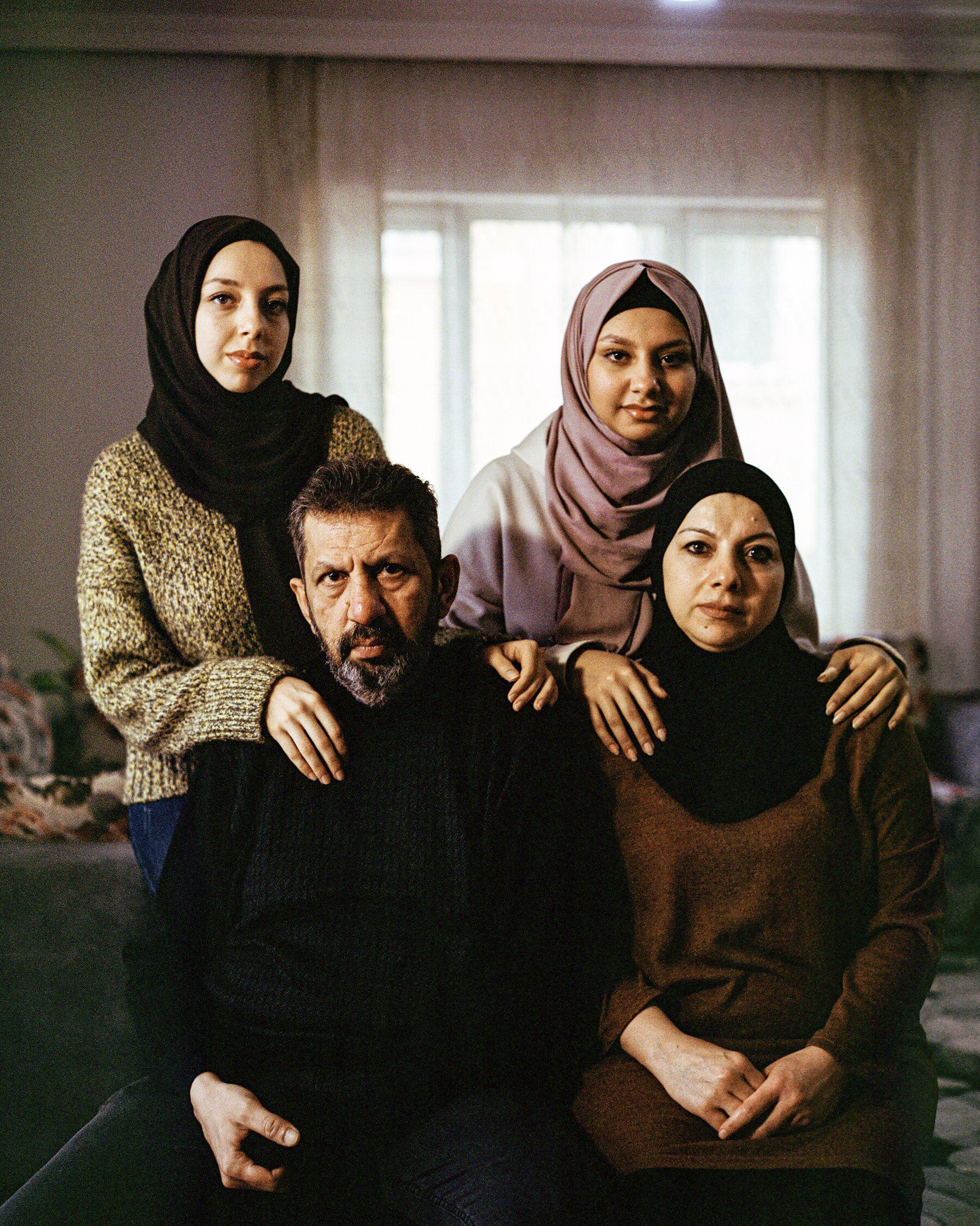 Clockwise from bottom right: Areej and Ahmad al-Khaldi with their daughters Shaghaf and Sama, at home in Sanliurfa, Turkey.