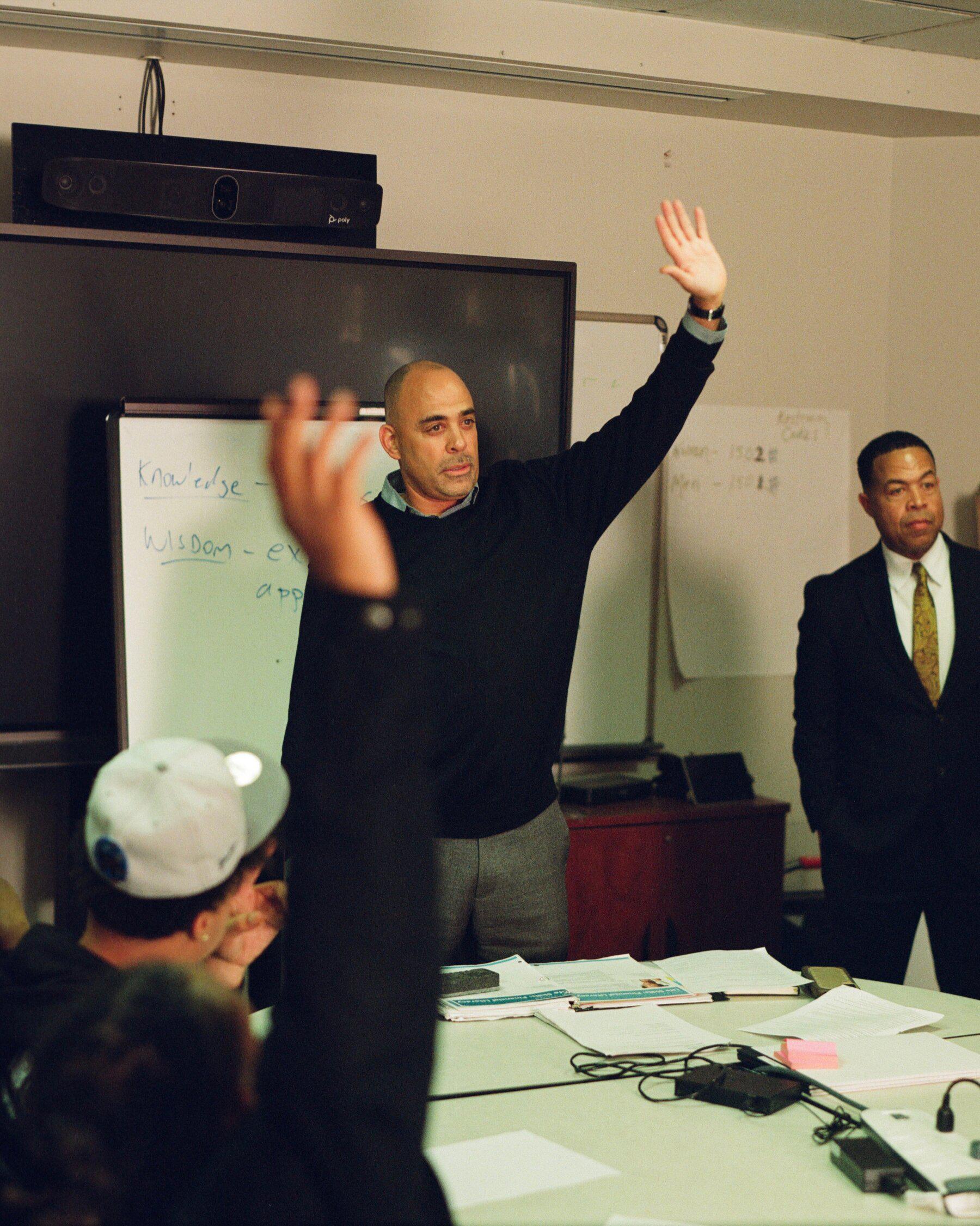 David Muhammad (center) teaching a session of the Healthy, Wealthy and Wise program in Oakland, Calif., for young people at risk of being involved in gun violence.