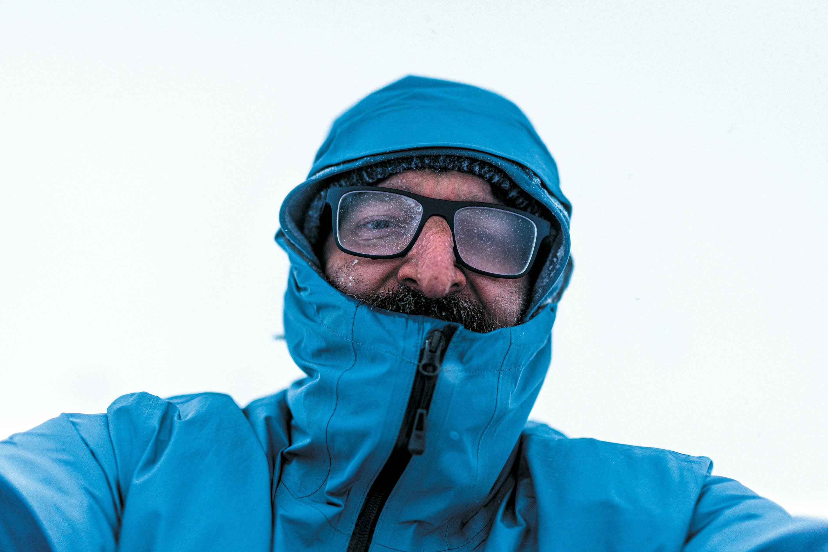 Image of Jeffery DelViscio in a blue winter coat and foggy glasses
