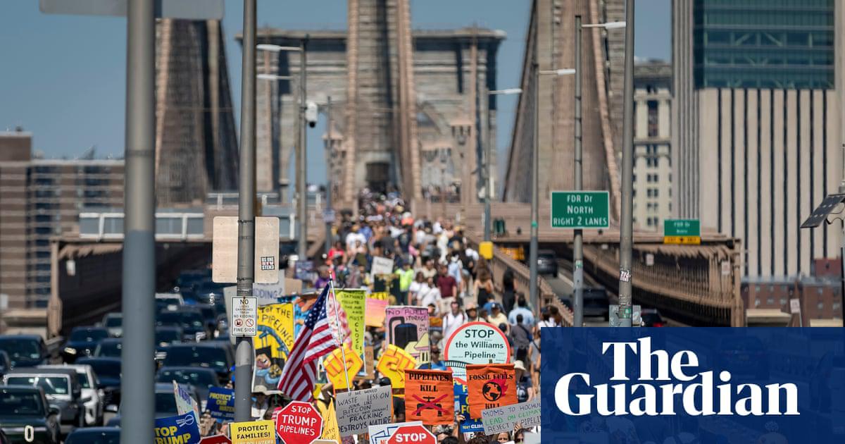 Climate activists march across the Brooklyn Bridge to demand a halt to the construction of the Williams Pipeline, on 9 August 2025.