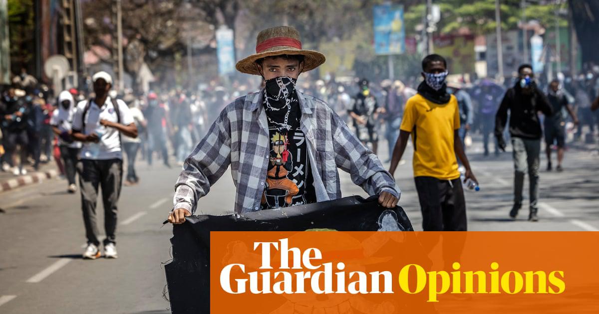 A student holds a flag bearing the logo of the popular Japanese manga One Piece during a protest in Madagascar on 9 October.