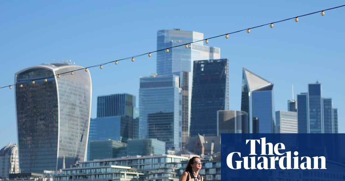 A commuter braves the July heat in London.