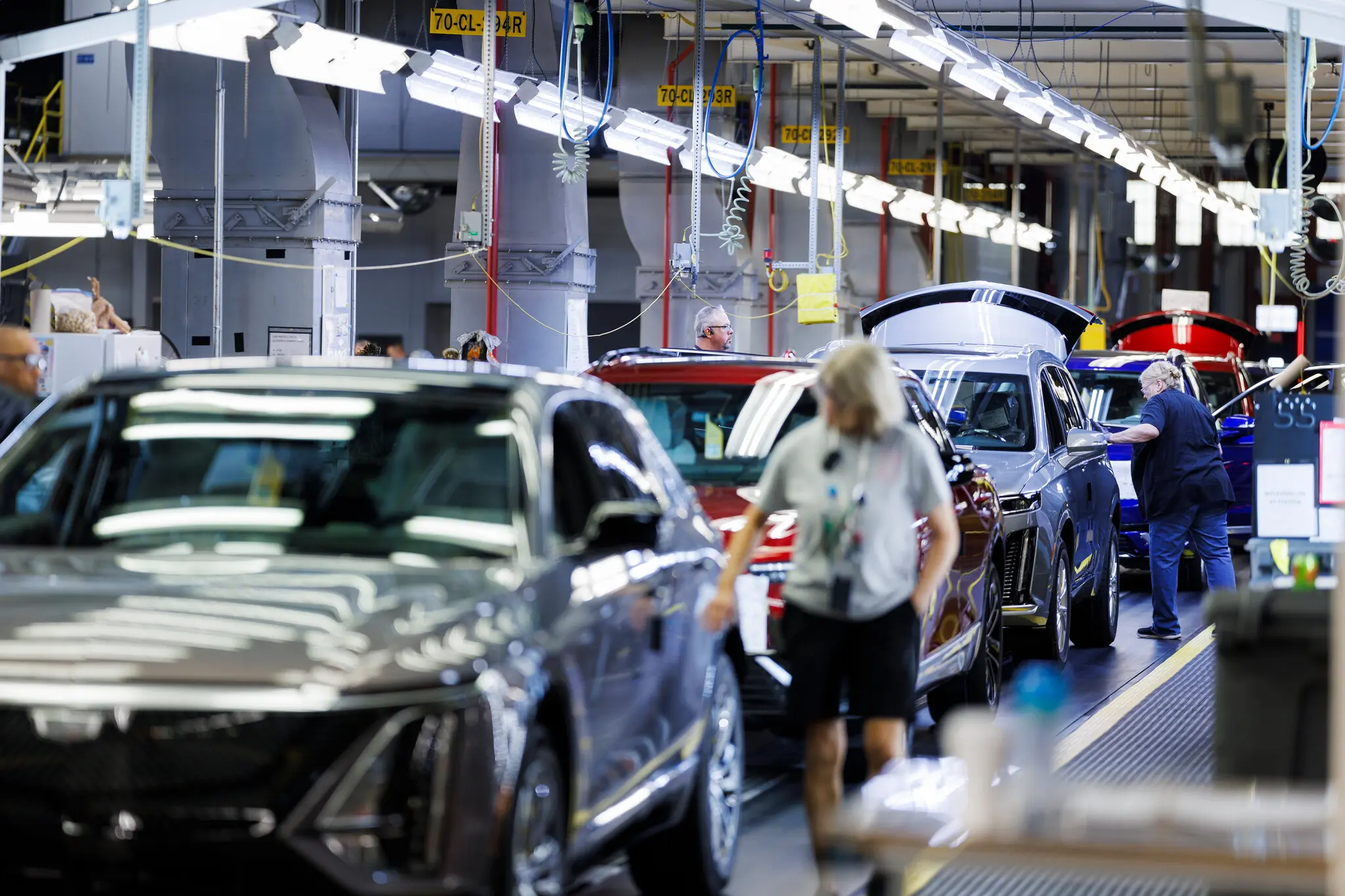 Vehicles passing through final inspection at the end of an assembly line at a General Motors facility in Tennessee.
