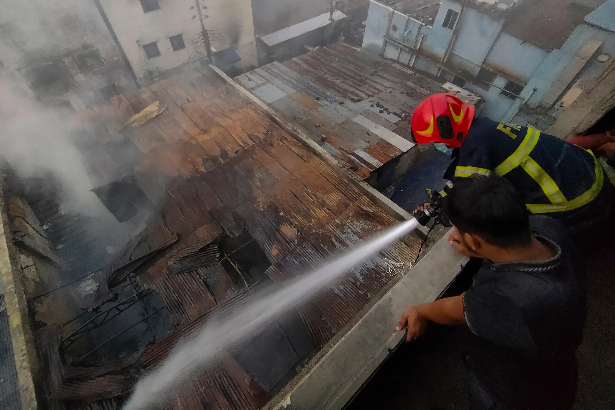 A firefighter worked to douse a blaze in Dhaka, Bangladesh, on Tuesday.