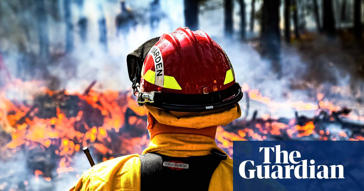 Firewardens with the New Jersey forest fire service demonstrate a firebreak in the Pinelands in March 2024.