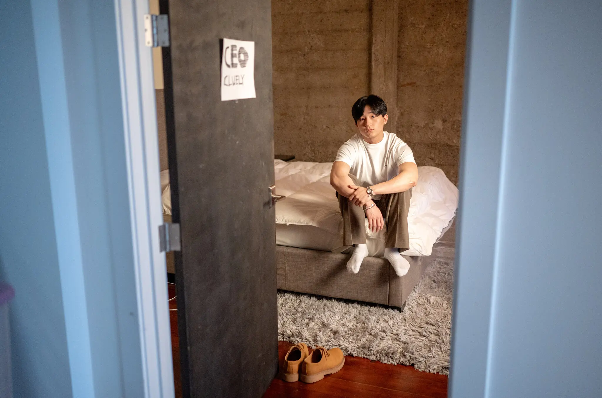 Roy Lee, Cluely’s chief executive, at his home in Cluely’s office in San Francisco. His start-up has leased apartments for its employees.