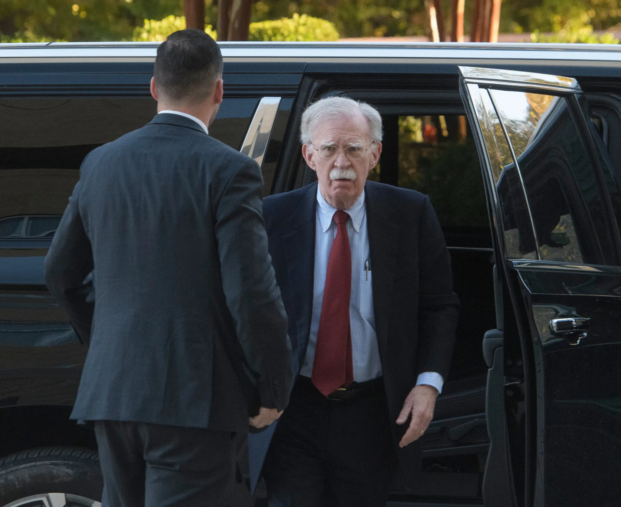 John R. Bolton arrived for his arraignment in federal court on Friday. He pleaded not guilty to 18 counts of mishandling classified information.