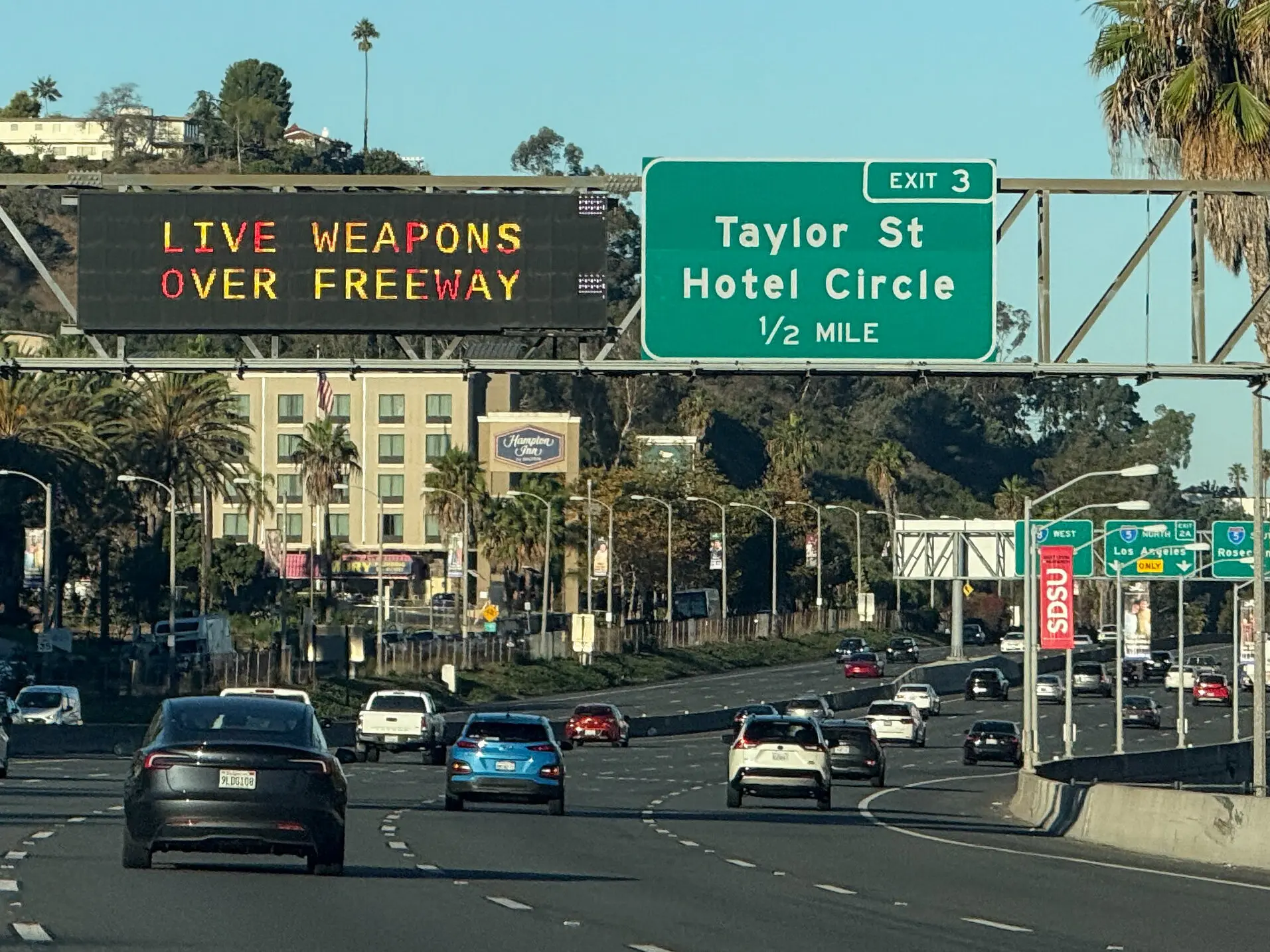 A warning over a highway near Interstate 5 alerted drivers about the military using live weapons on Saturday.