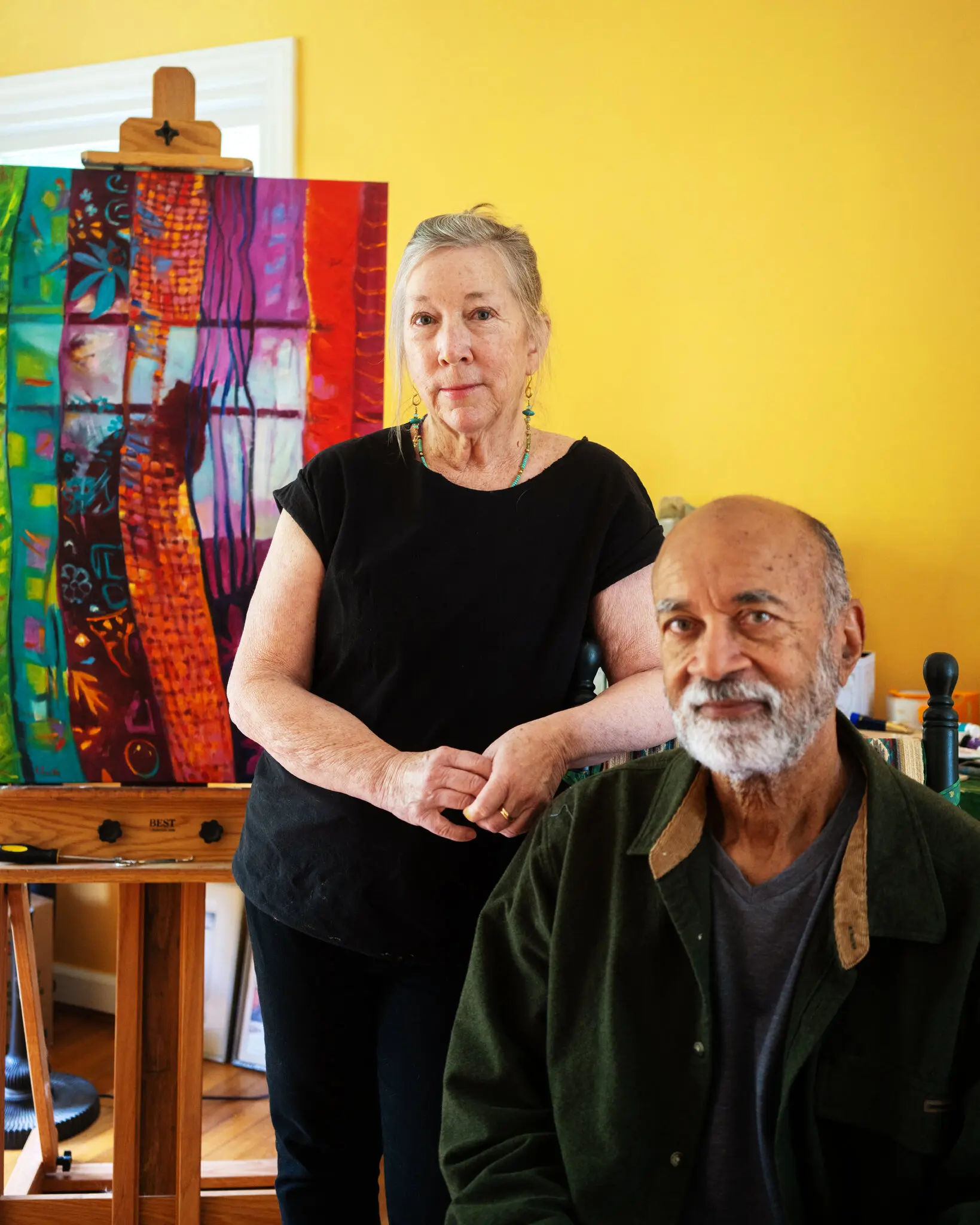 Kate Ferriter and her husband, Terry Moore, in her art studio at their home in Windham, Conn. The couple, who are in their 70s, have moved four times since Mr. Moore retired.