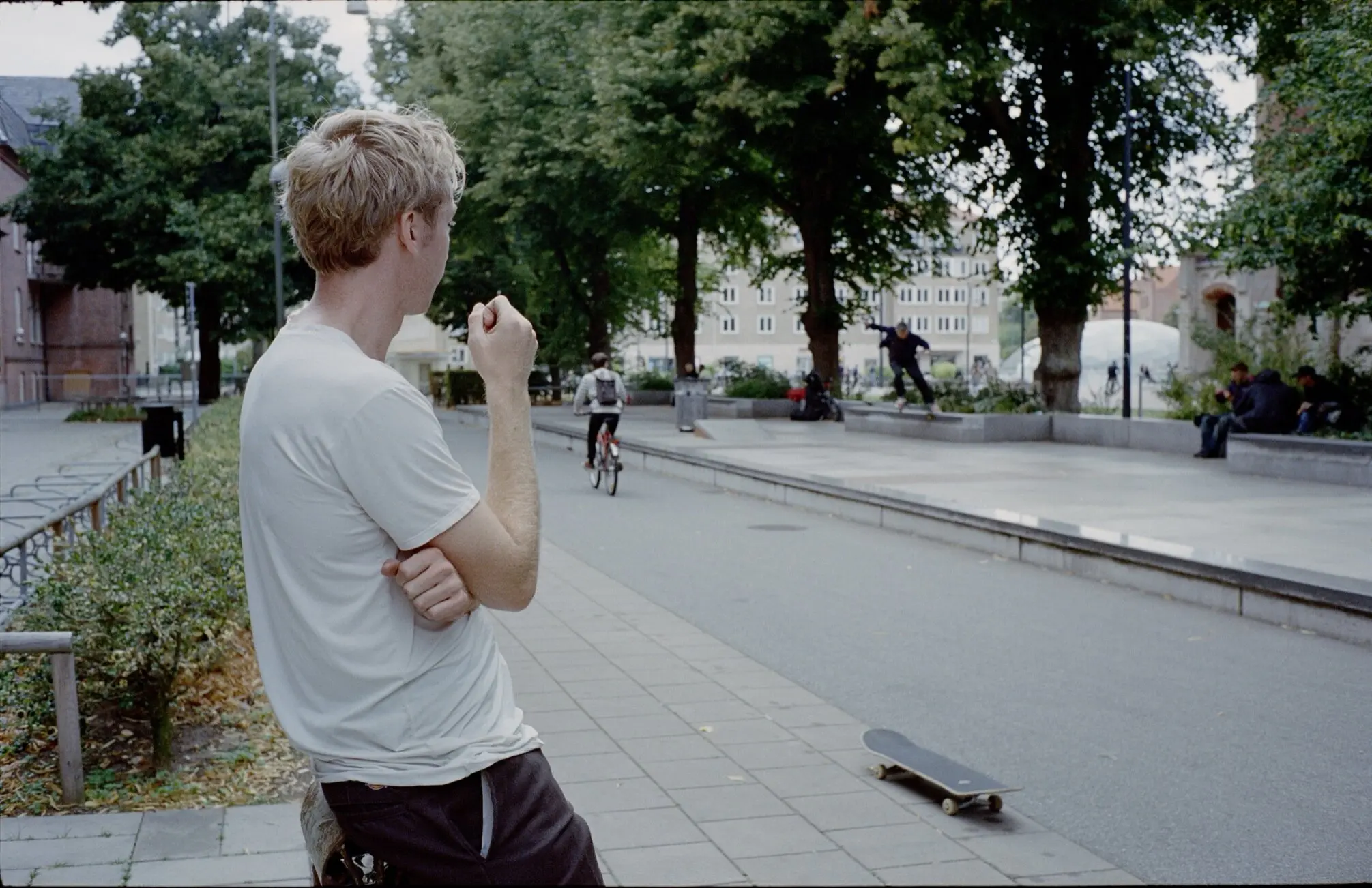 The author (in background) doing a crooked grind at Love Malmo in August.