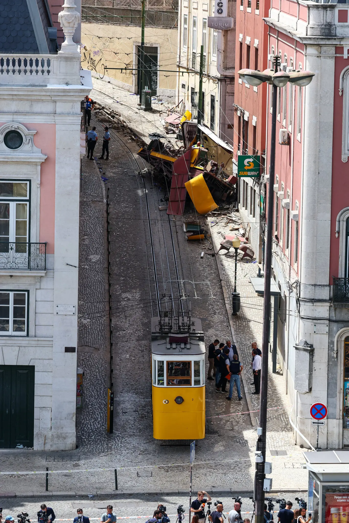 The aftermath of the funicular crash last month in Lisbon that killed 16. A report said that the cable that snapped was not certified for use in public transportation.