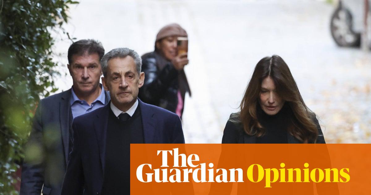 Nicolas Sarkozy, pictured with his wife, Carla Bruni, on his way to La Santé prison on 21 October.