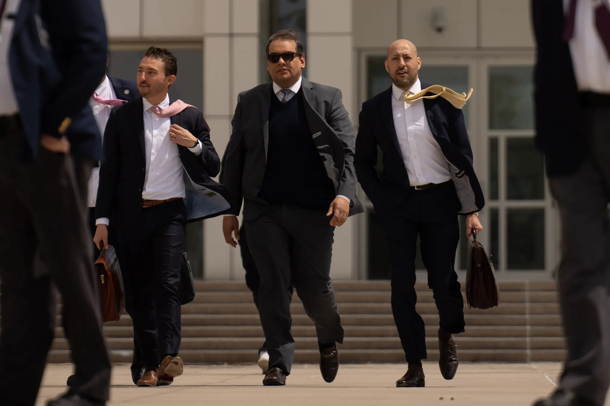 George Santos, seen leaving federal court after his sentencing, said on TV that he didn’t care about the “pearl clutching” of those who were critical of his release.