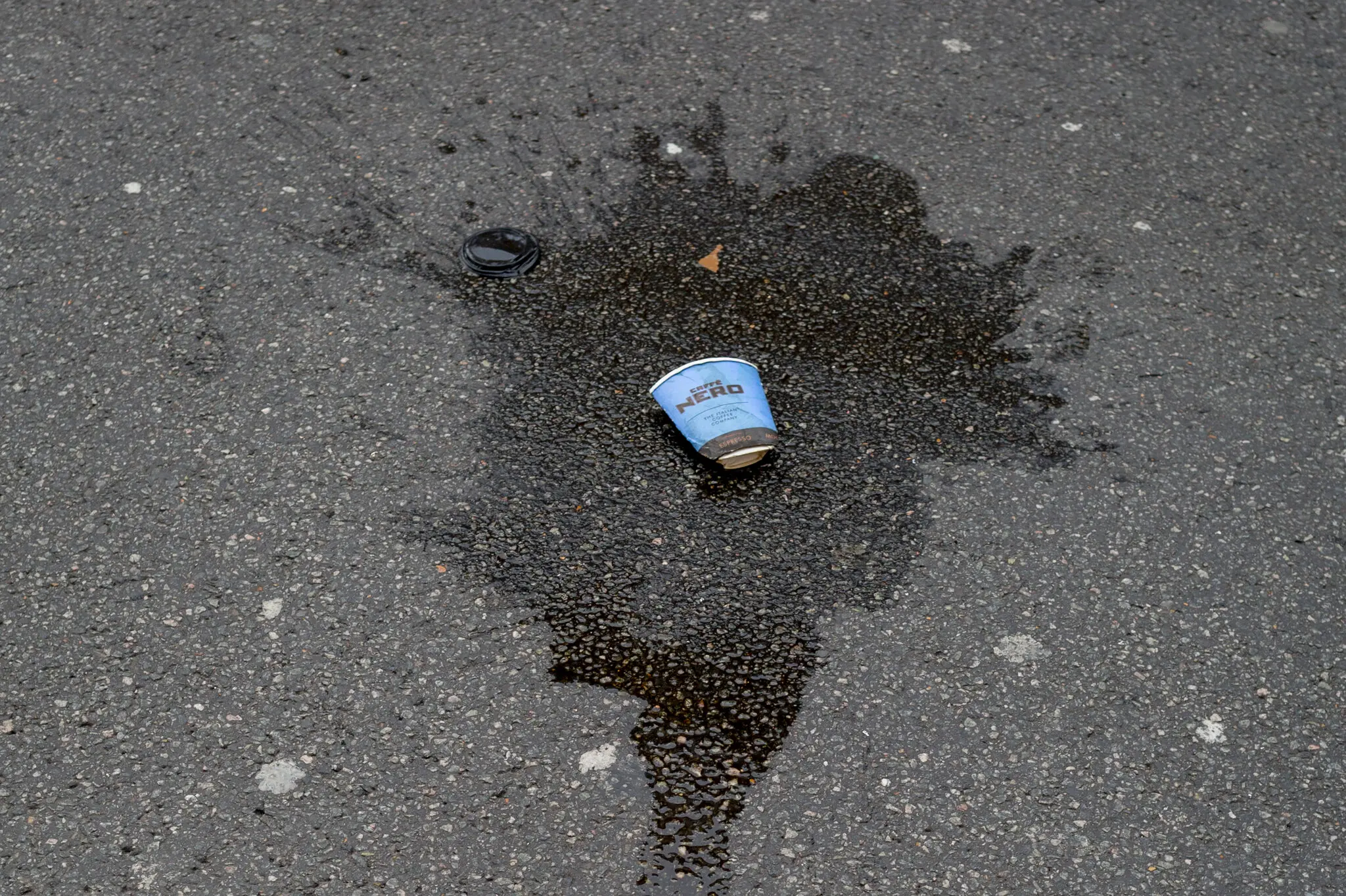 Officers approached a woman after she had poured out her coffee, which put her in violation of Section 33 of the British Environmental Protection Act.