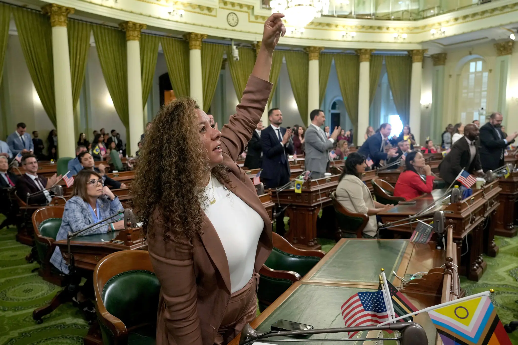 Assemblywoman Sade Elhawary celebrates after the State Assembly approved the first of three bills to redraw California’s congressional districts if voters approve.