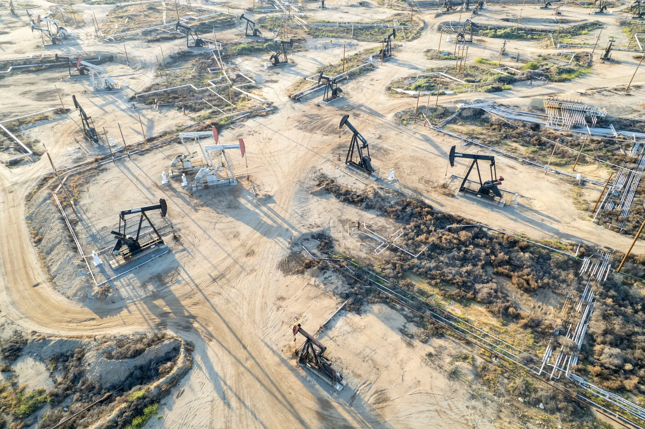 Absent a meaningful upswing in prices, U.S. oil production is likely to level off, if not decline, executives said.