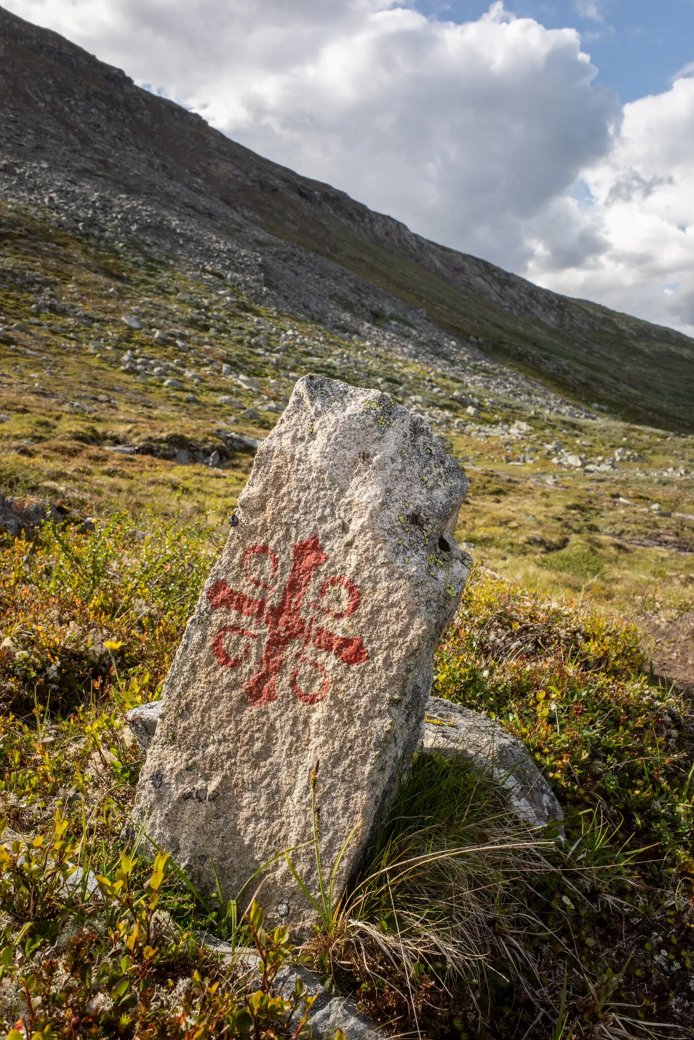A stone marker along a pilgrimage trail in Forollhogna National Park.