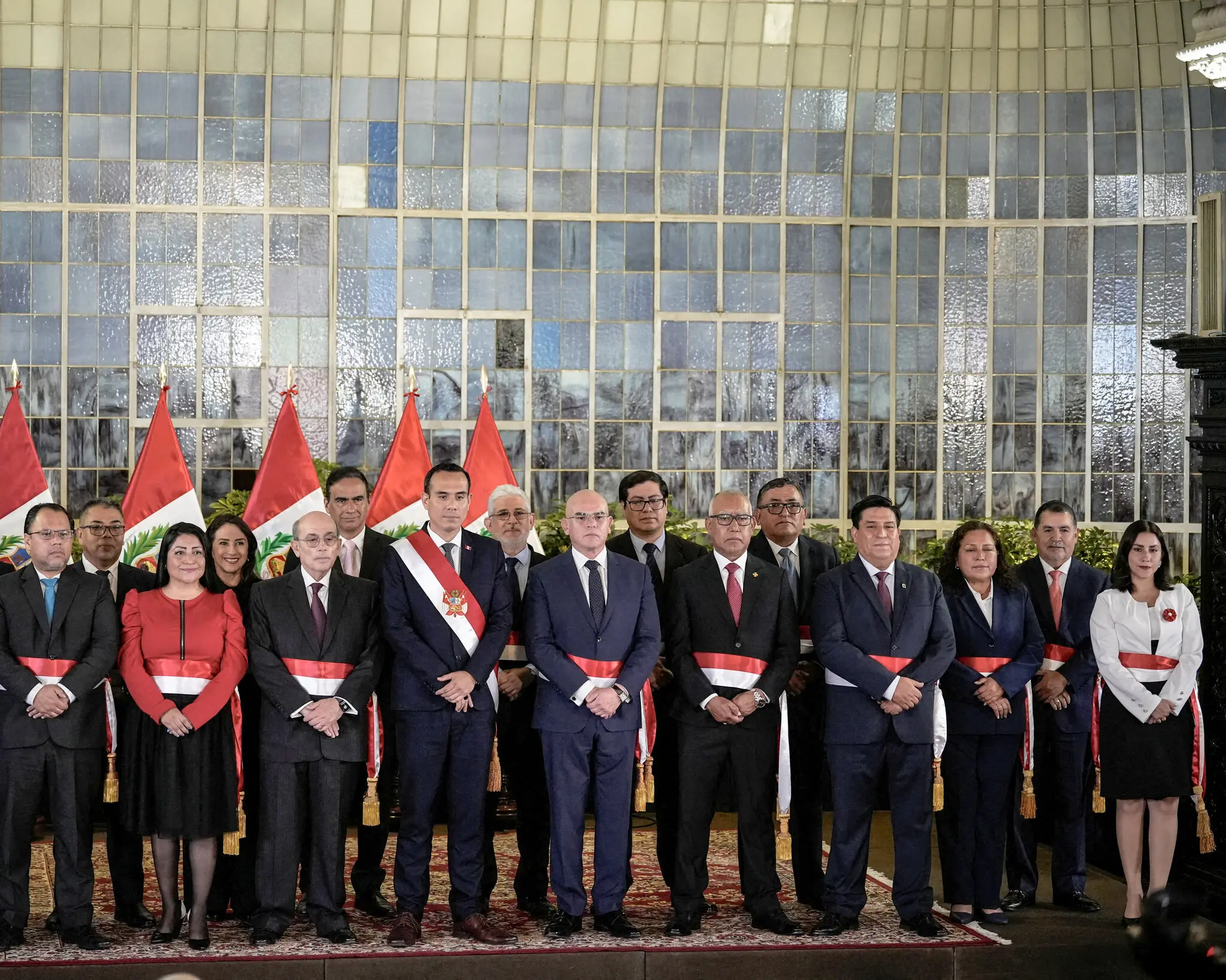 The interim president of Peru, José Jerí, in diagonal sash, with cabinet members. Three of his predecessors within the last five years have been impeached.