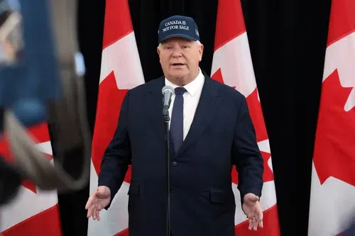 Doug Ford, Ontario’s premier, wears a “Canada Is Not For Sale” hat as he arrives at a meeting of the premiers and prime minister in January.