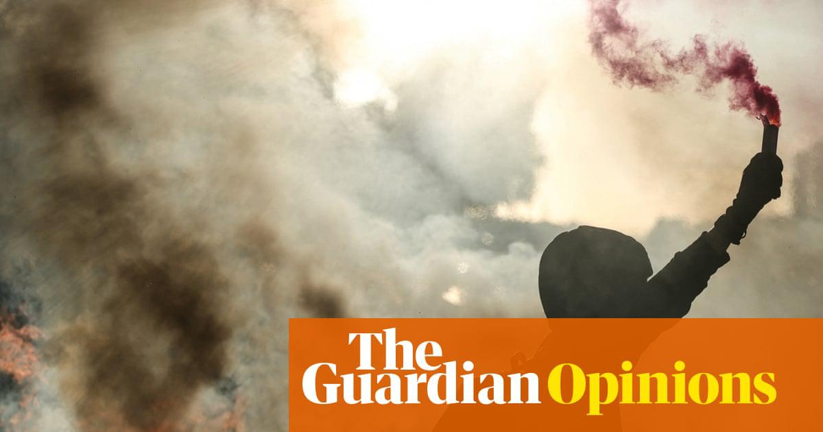 A protester by a flaming barricade during the Block Everything protests in Paris, 10 September 2025.