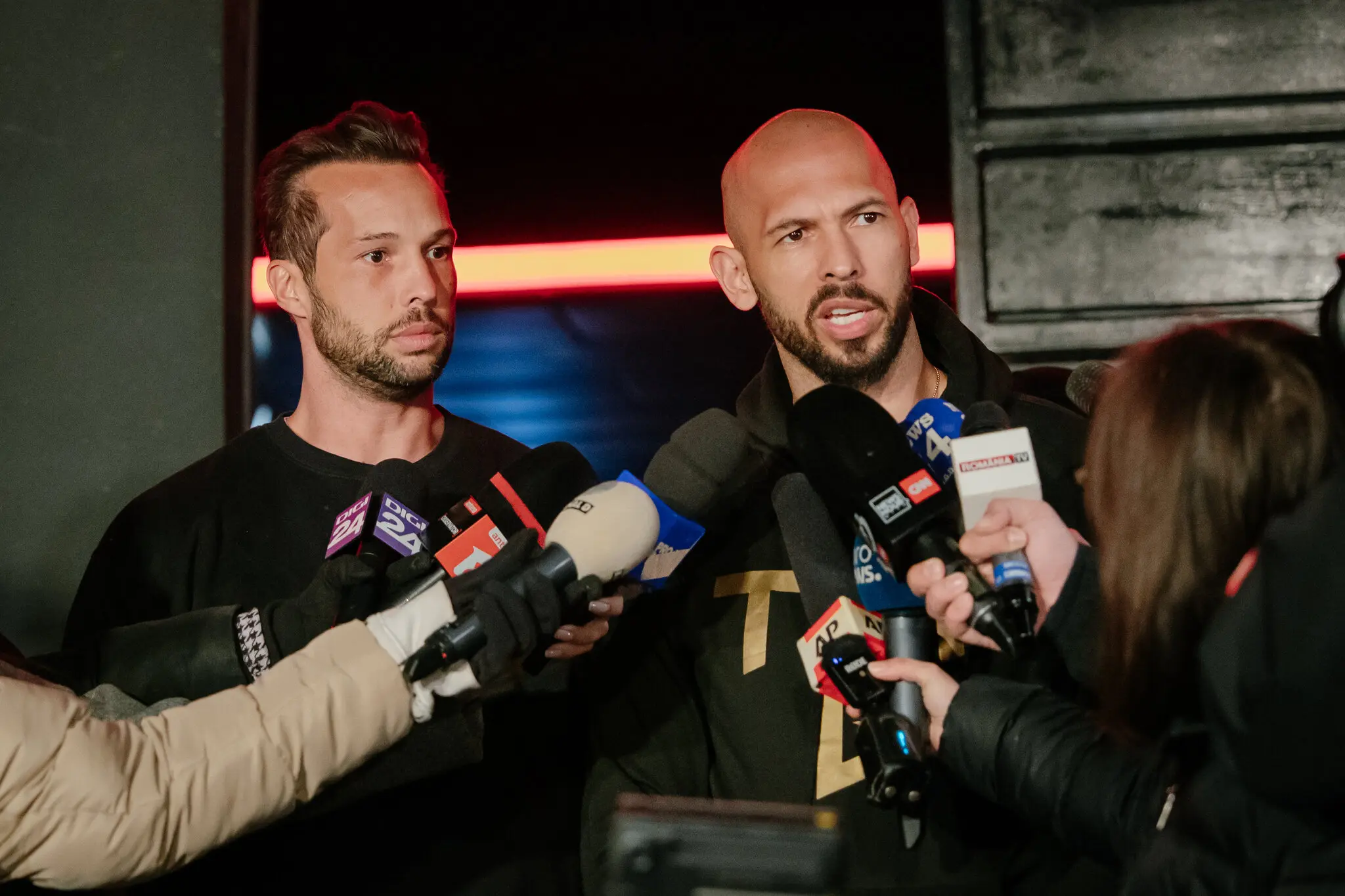 Tristan Tate, left, and his brother Andrew Tate in Bucharest, Romania, this year. 