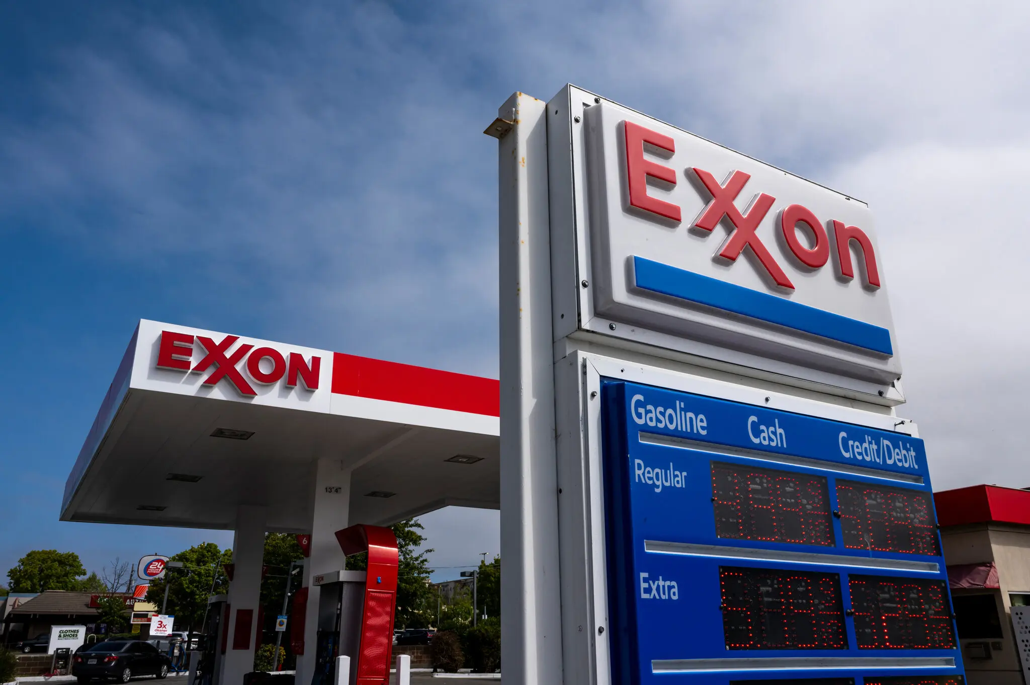 The laws Exxon is challenging would affect several thousand large companies in the state. An Exxon station in Albany, Calif.