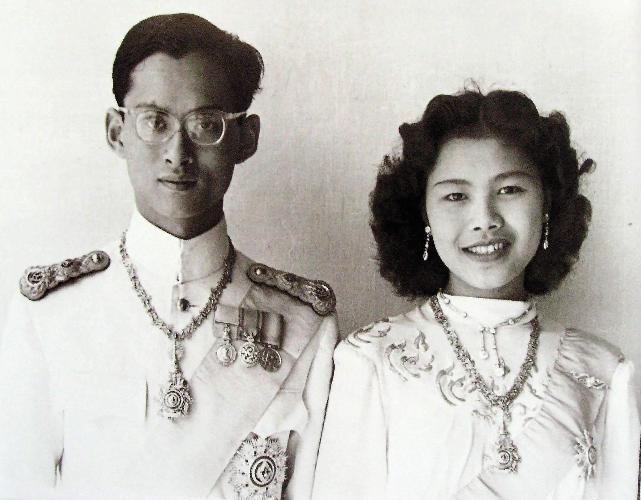 Queen Sirikit of Thailand with King Bhumibol Adulyadej. For decades their portraits appeared in houses and shops around the country.