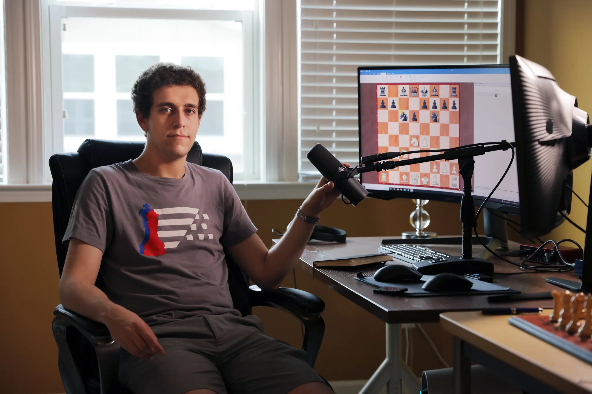 Daniel Naroditsky, a chess grandmaster, in his home office in Charlotte, N.C., in 2022. On Monday, the news of his death stunned the chess world.
