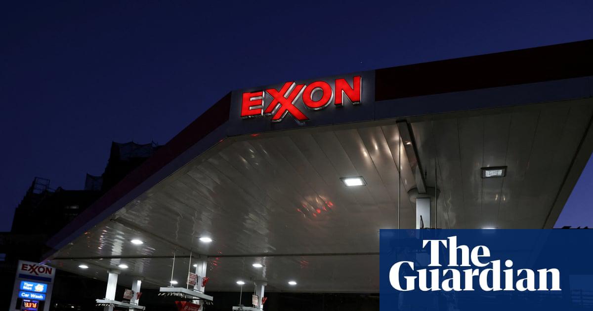 Cars are seen at an Exxon gas station in Brooklyn, New York City, on 23 November 2021.