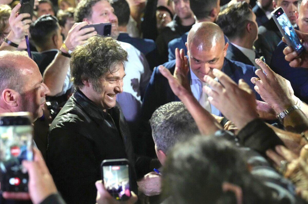 Argentina's President Javier Milei smiles to supporters in Buenos Aires after his party's success in midterm legislative elections, Oct. 26.