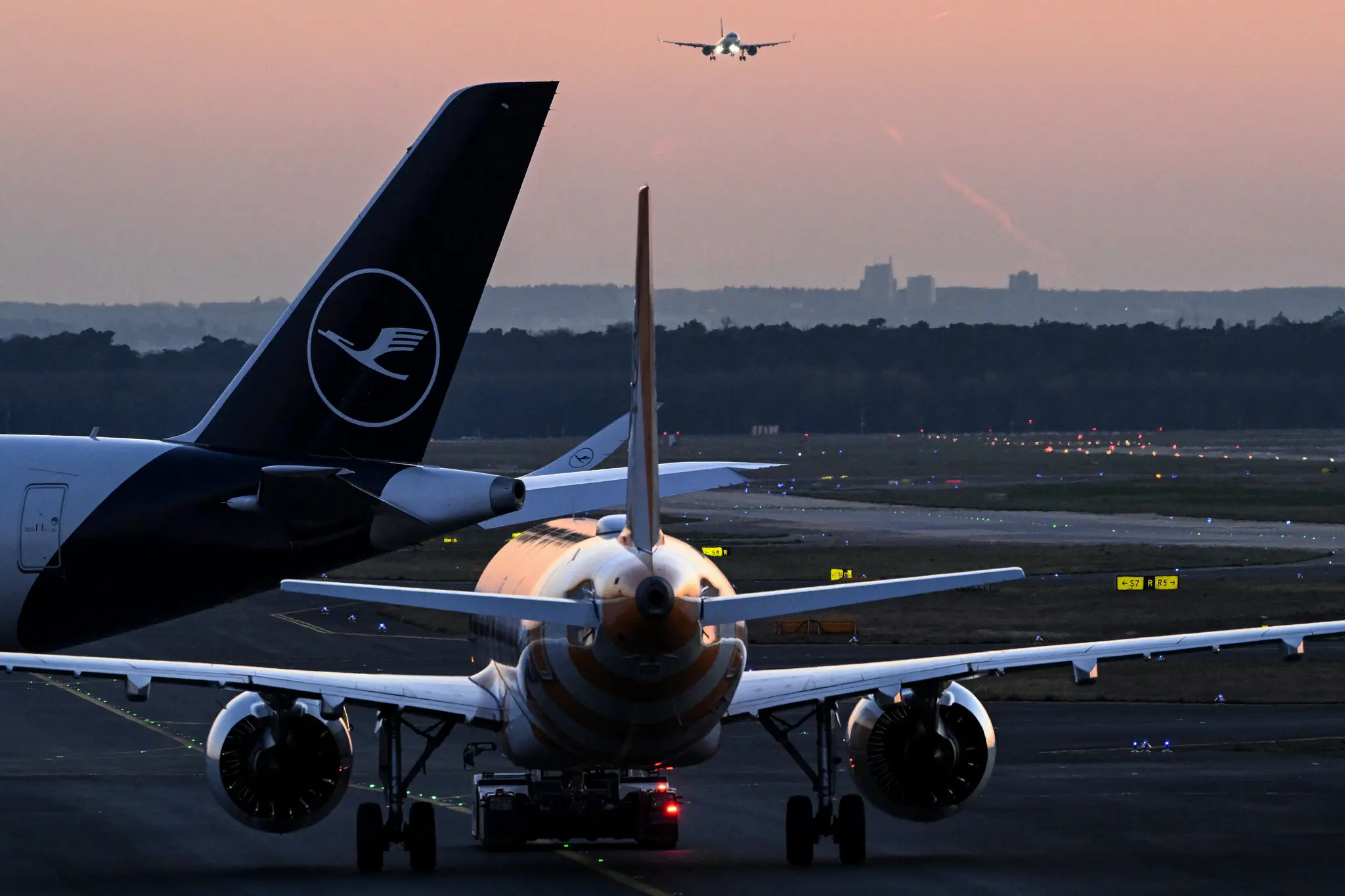 A Lufthansa flight from Chicago to Germany was forced to divert to Boston after a passenger attacked two teenagers with a metal fork, according to the federal prosecutors.