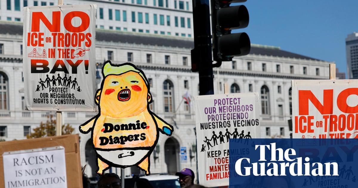 People protest against the Trump administration in San Francisco on 23 October.
