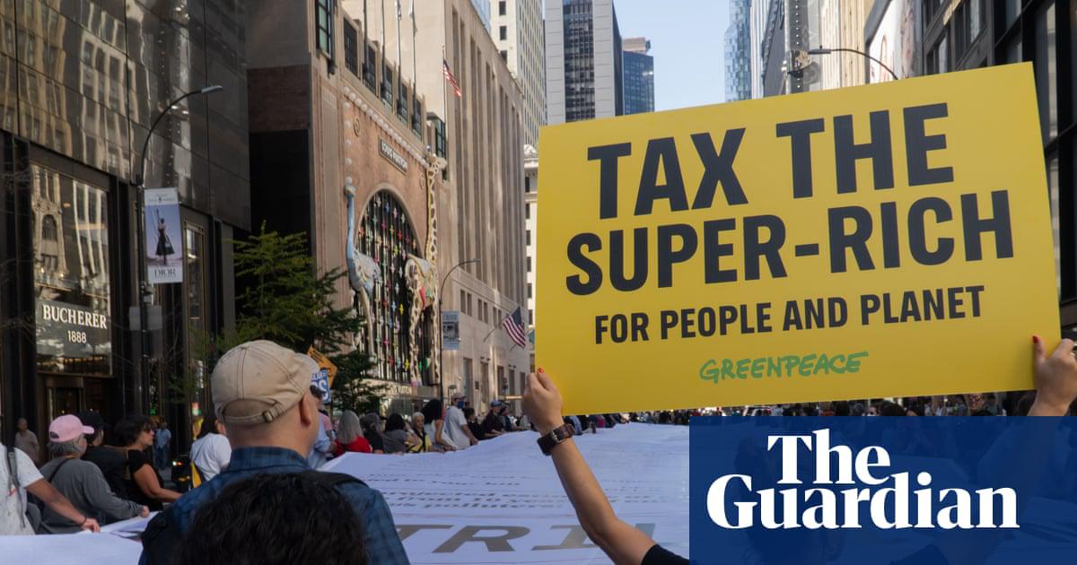 A view from the back of Greenpeace USA's Polluters' Climate Bill which lists economic damages it claims have been brought on by five major oil and gas companies, last month.