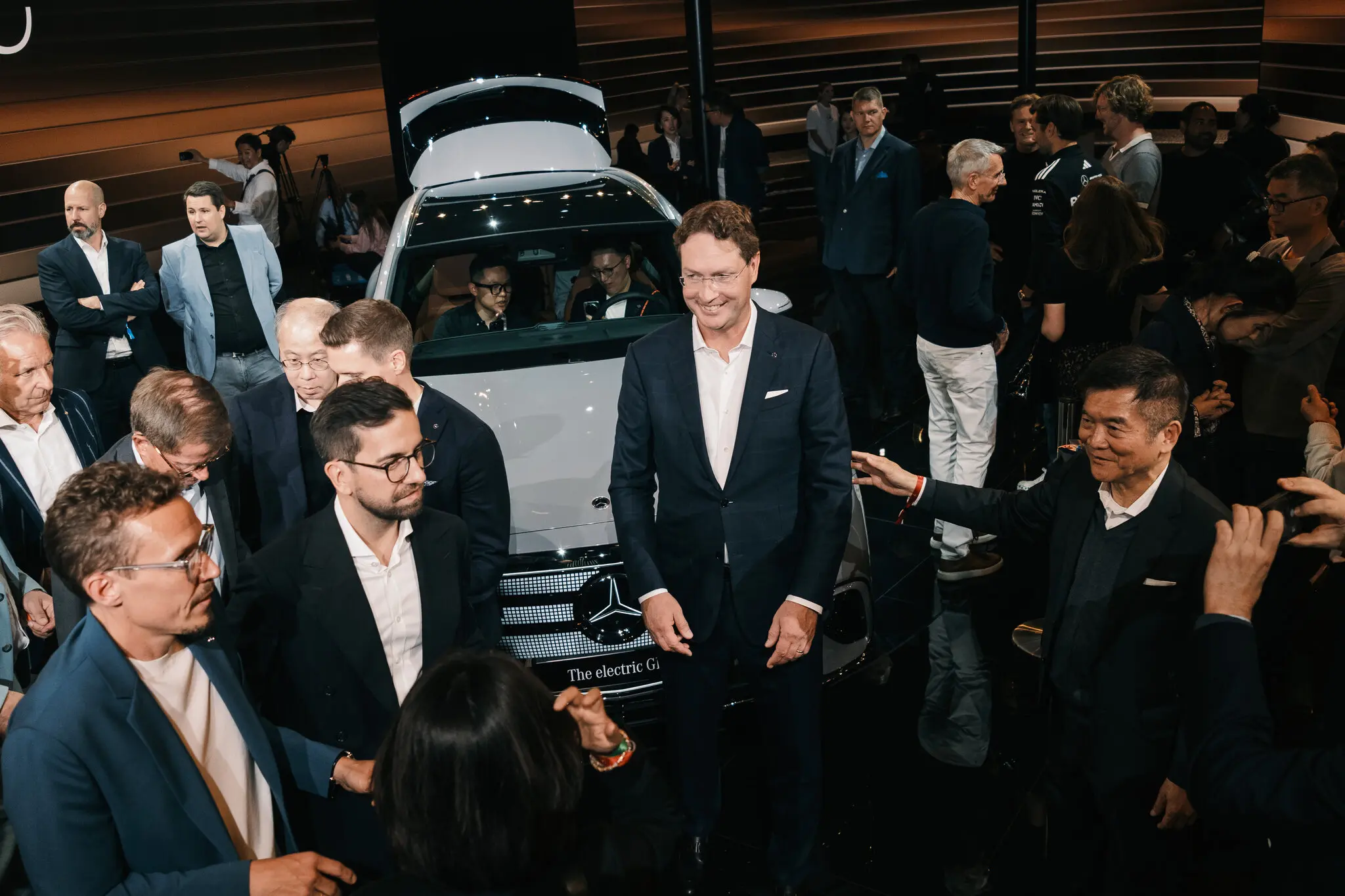 Ola Källenius, center, the chief executive of Mercedes-Benz, unveiled a new electric vehicle at an auto show in Munich in September.
