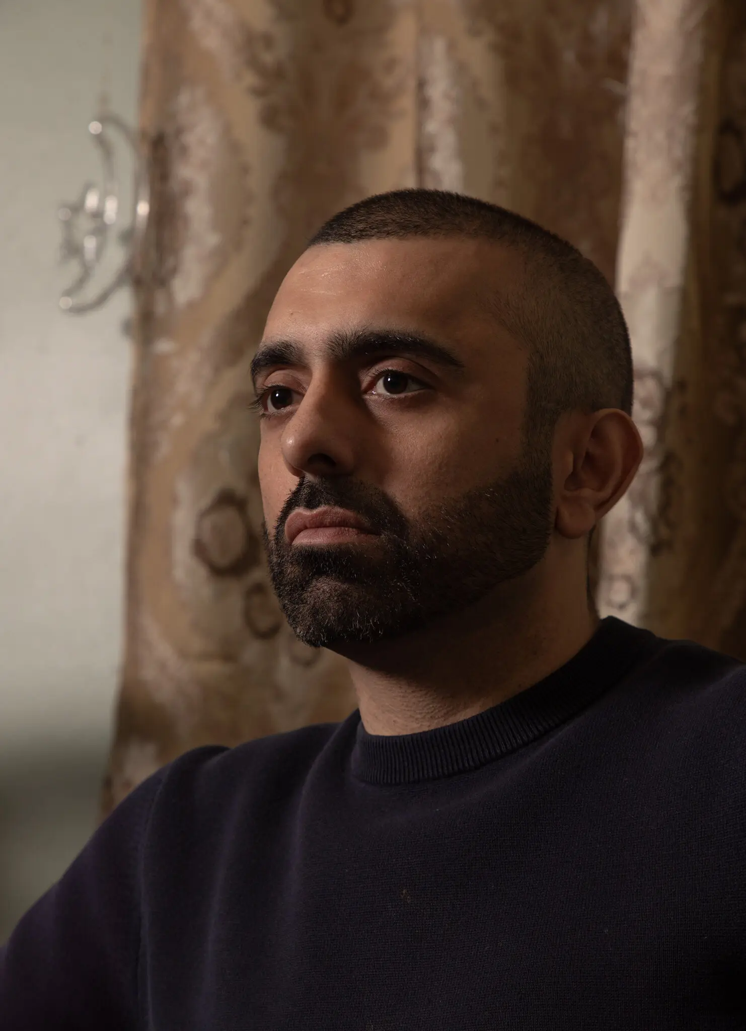 Hassan Naveed said he was wrongfully dismissed by the Adams administration.