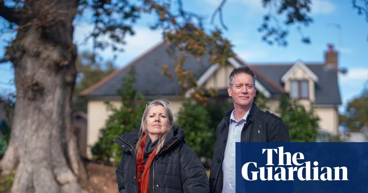 Linda and Scott Taylor Cantrill outside their home in Exmouth, Devon. She has turned ‘into Boudicca’ to stop the chainsaws, she says.