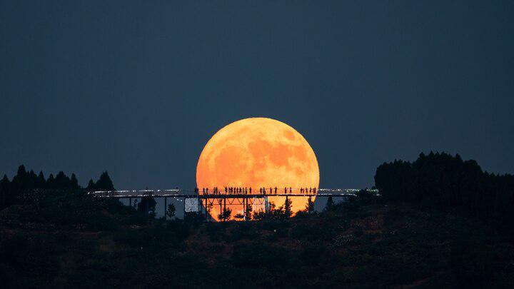 A supermoon lights up Longquan Mountain in Chengdu, China, on August 19, 2024. This November’s full moon will appear even closer to Earth, glowing larger and brighter in the autumn sky.