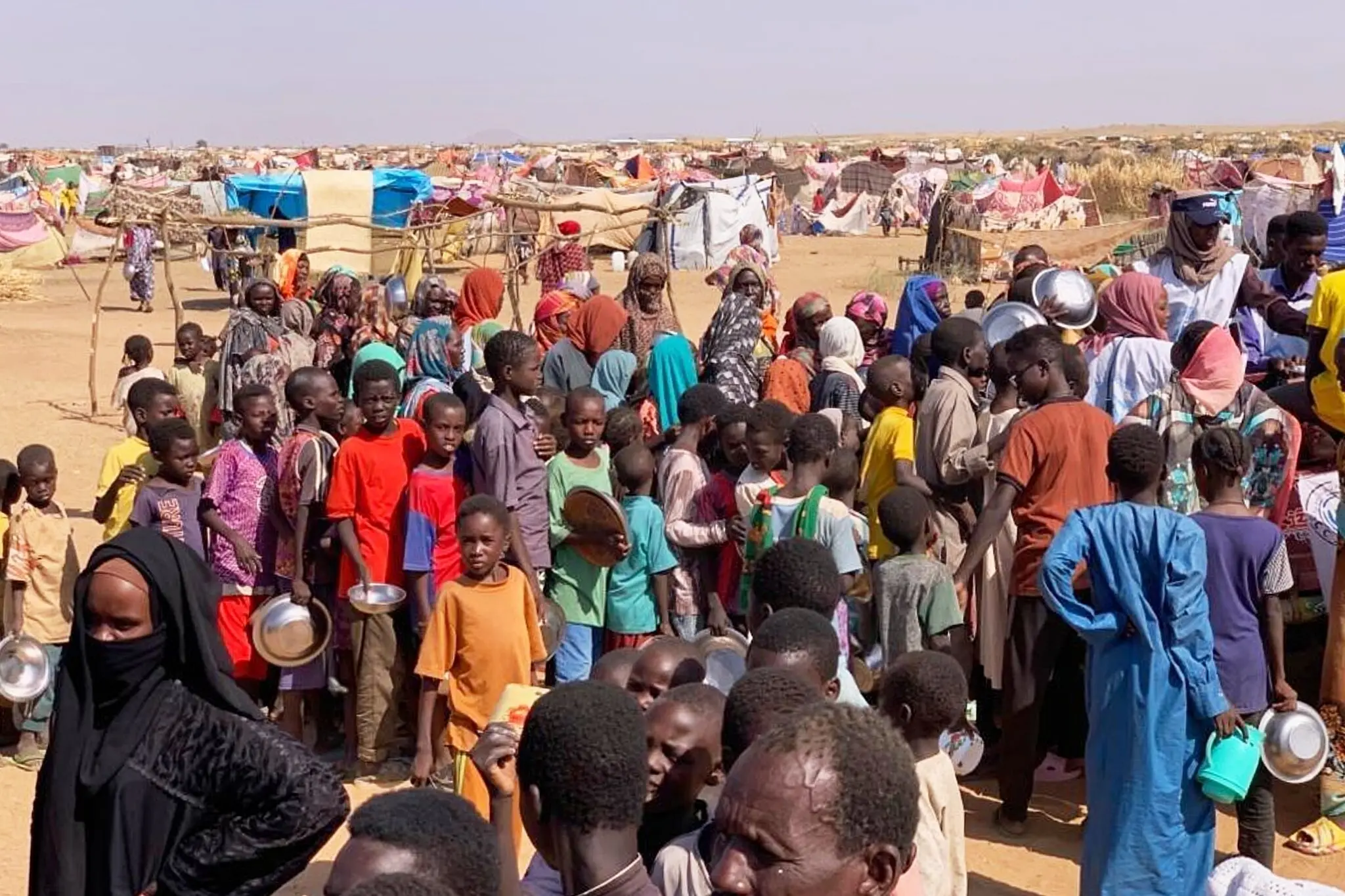 A photo released by the Norwegian Refugee Council showing internally displaced people from El Fasher in Tawila, in the Darfur region of Sudan, on Friday.