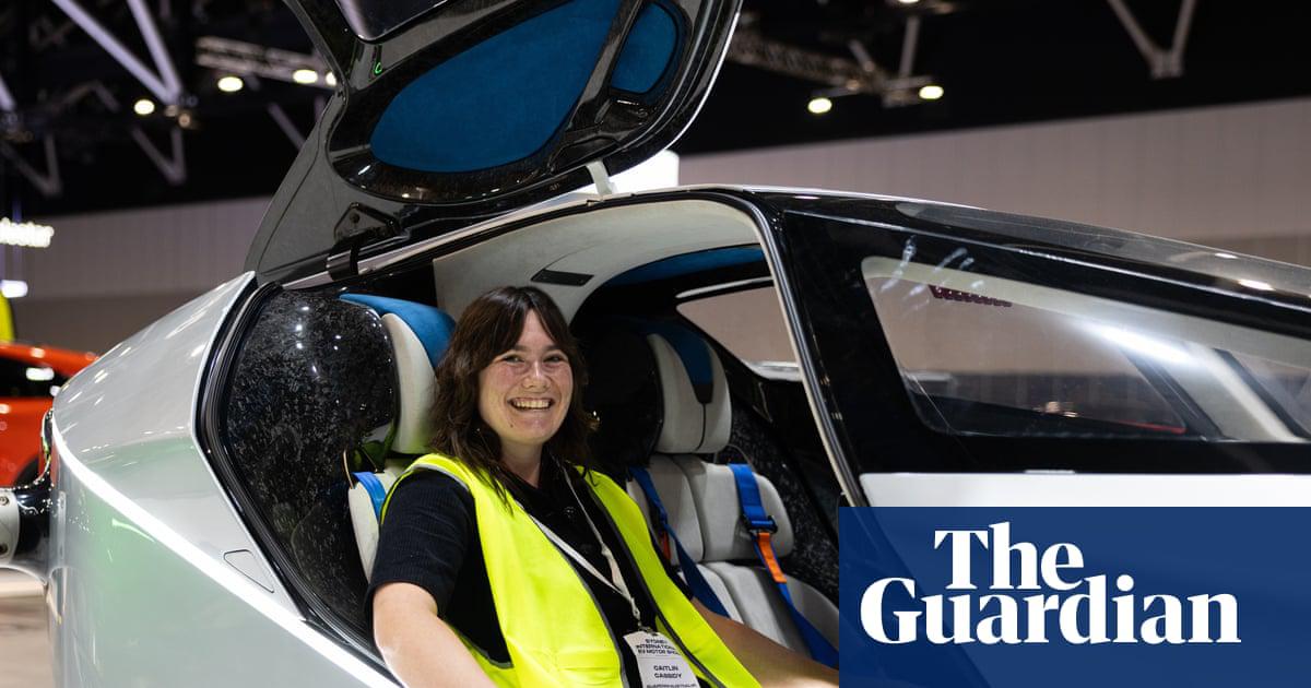 ‘Are we all going to be driving flying cars in the future?’ Caitlin Cassidy has questions as she sits in the XPeng X2 Flying Car at the EV Motor Show in Sydney.