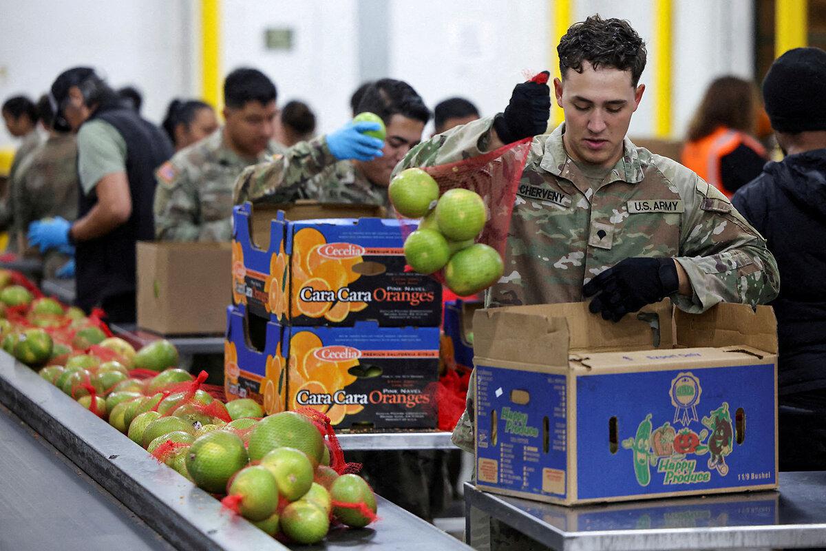 Members of the National Guard packs food at a Los Angeles Regional Food Bank facility, as nearly 42 million Americans face a potential lapse in federal food-assistance benefits, in Los Angeles, Oct. 29, 2025.
