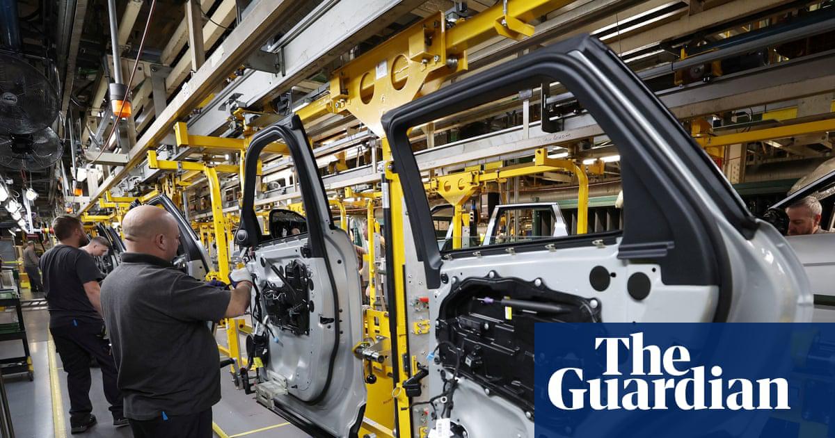 Workers on the production line at Jaguar Land Rover's Halewood factory. Consumers increased spending on new cars in October.