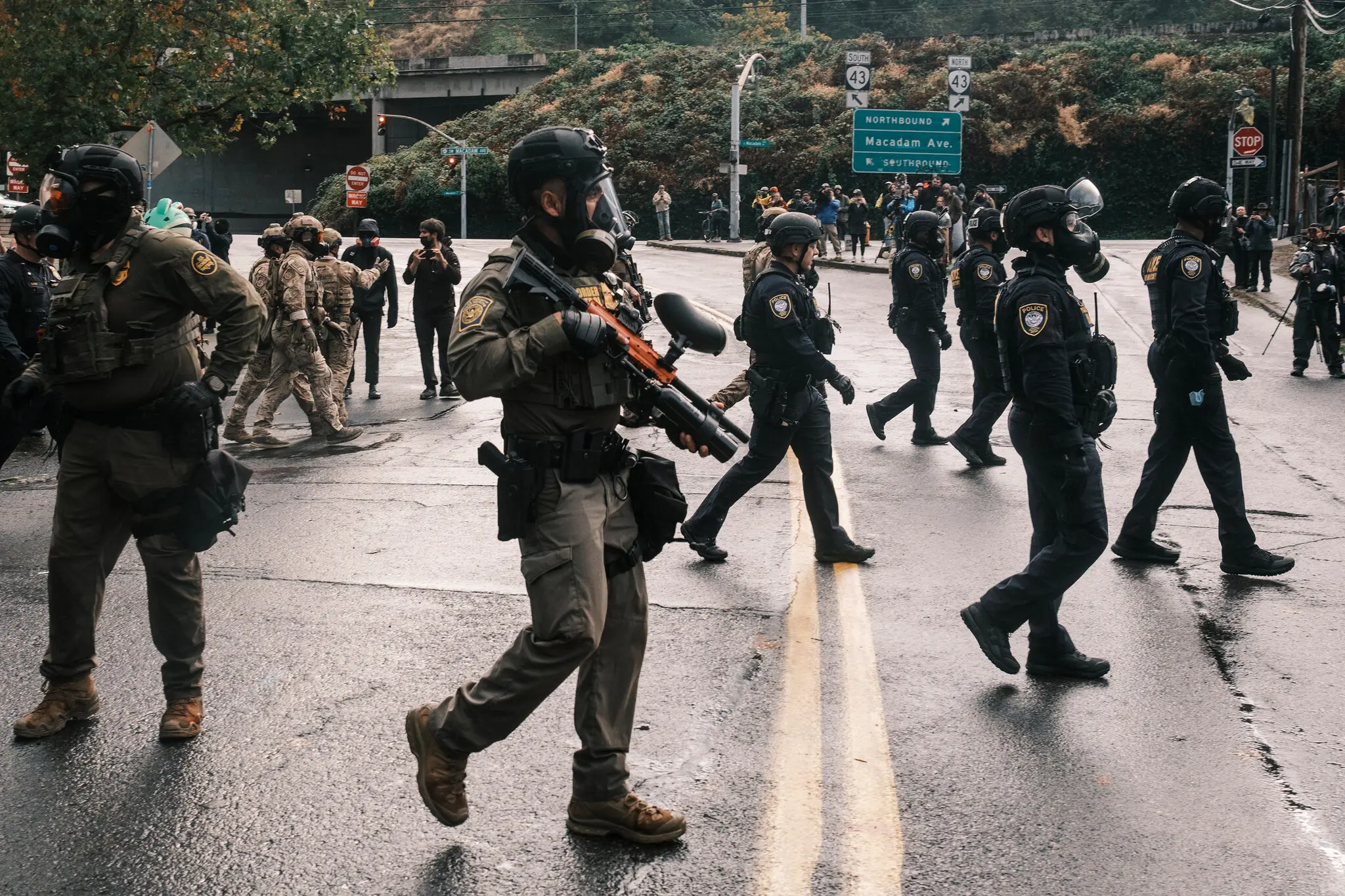 Federal officers moving a crowd of protesters in front of an ICE detention center in Portland, Ore., on Oct. 12.