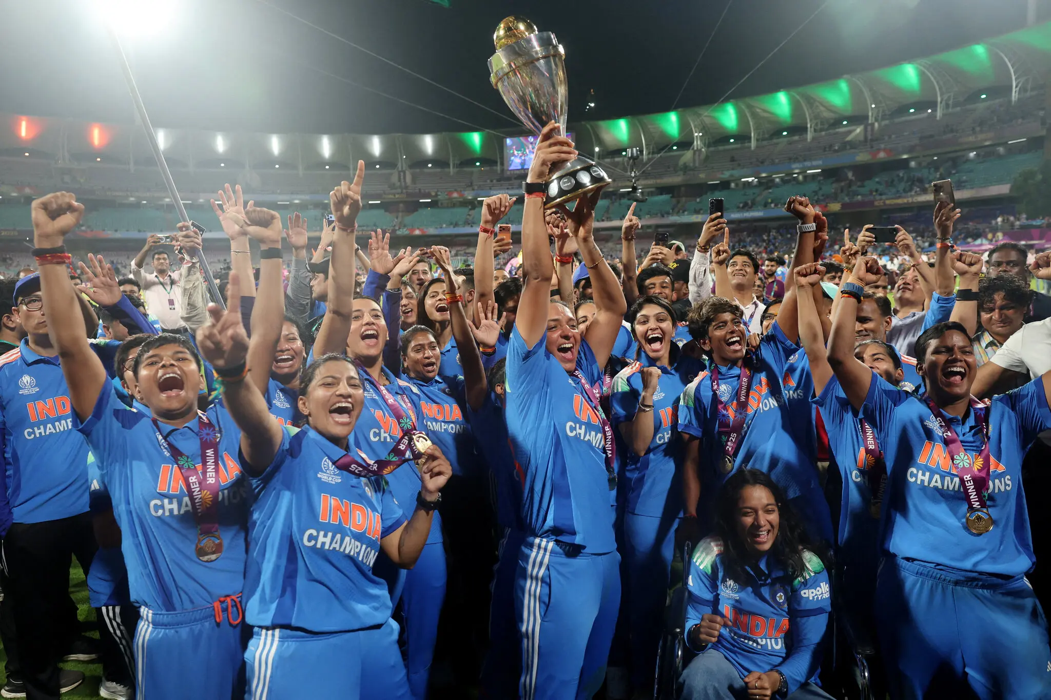 Harmanpreet Kaur and her teammates on India’s national women’s cricket team celebrate their win, right after midnight on Monday, in Mumbai, India.