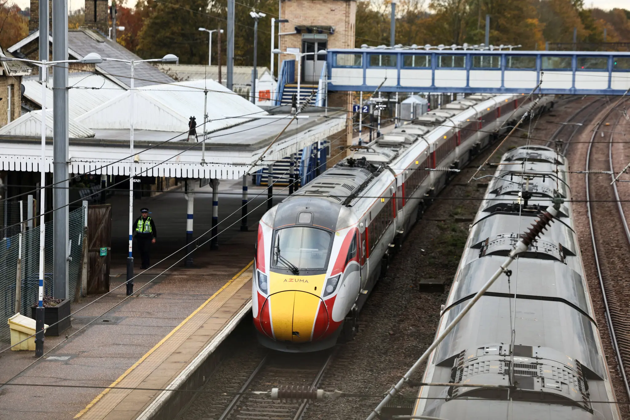 A police officer at Huntingdon Station in England on Sunday, near the train where the attack unfold.