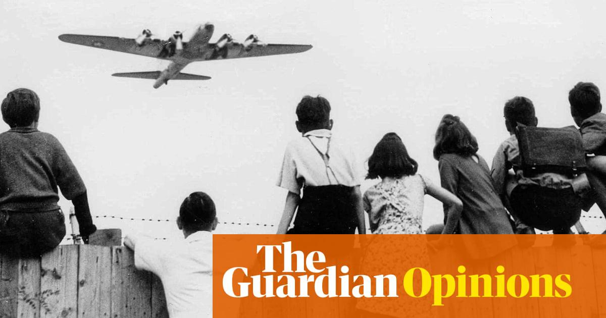 West Berlin children at Tempelhof airport watch fleets of US airplanes bring in supplies during the 1948-49 Berlin airlift.