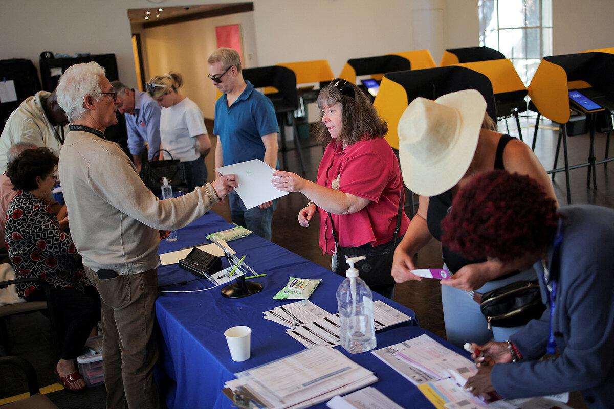 Voters receive ballots to cast their votes on Proposition 50 at the Beverly Hills City Hall voting center in Beverly Hills, California, Oct. 30, 2025.