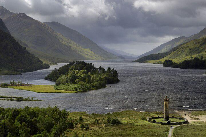 The lone Highlander atop the Glenfinnan Monument, situated on the edge of Loch Shiel, is just one of many sites that hikers, runners, and walkers may encounter along the West Highlands Way in Scotland.
