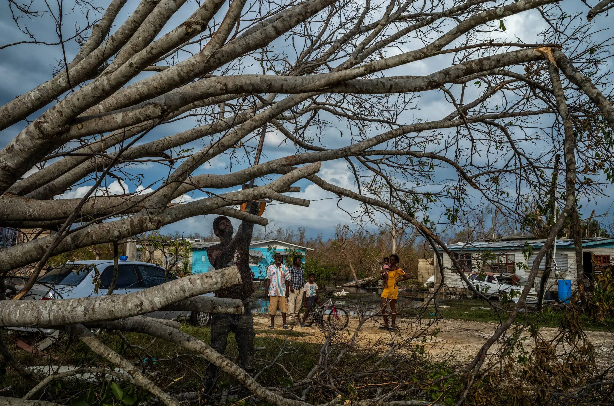 Clearing fallen trees in Westmorelands Parish, in western Jamaica, on Sunday.